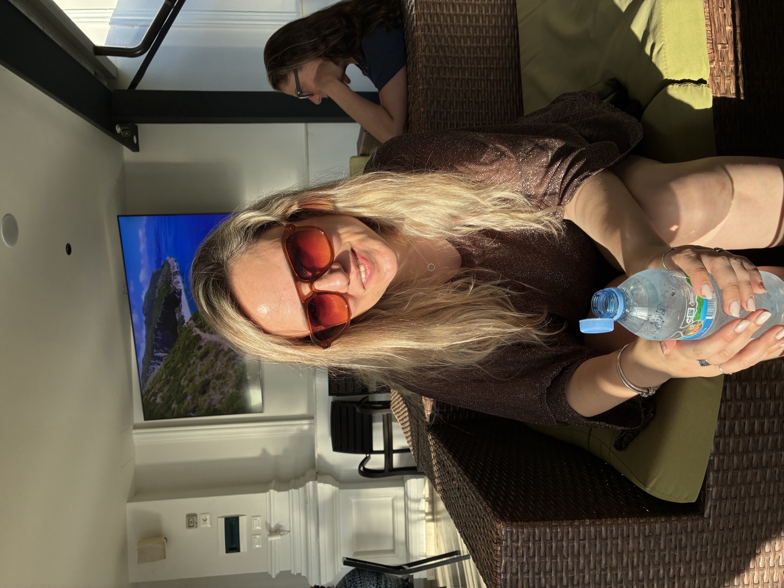 Carla working on the accommodation terrace with views over the Balkan landscape