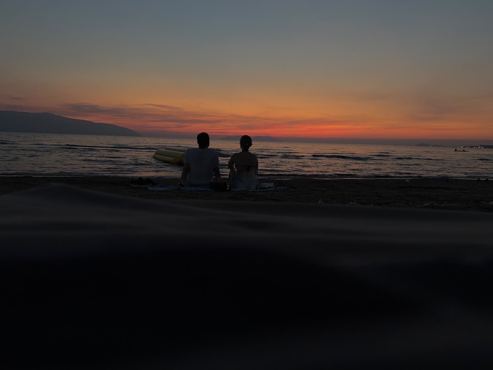Carla and Gonzalo at sunset by the Aegean sea during the Balkans road trip