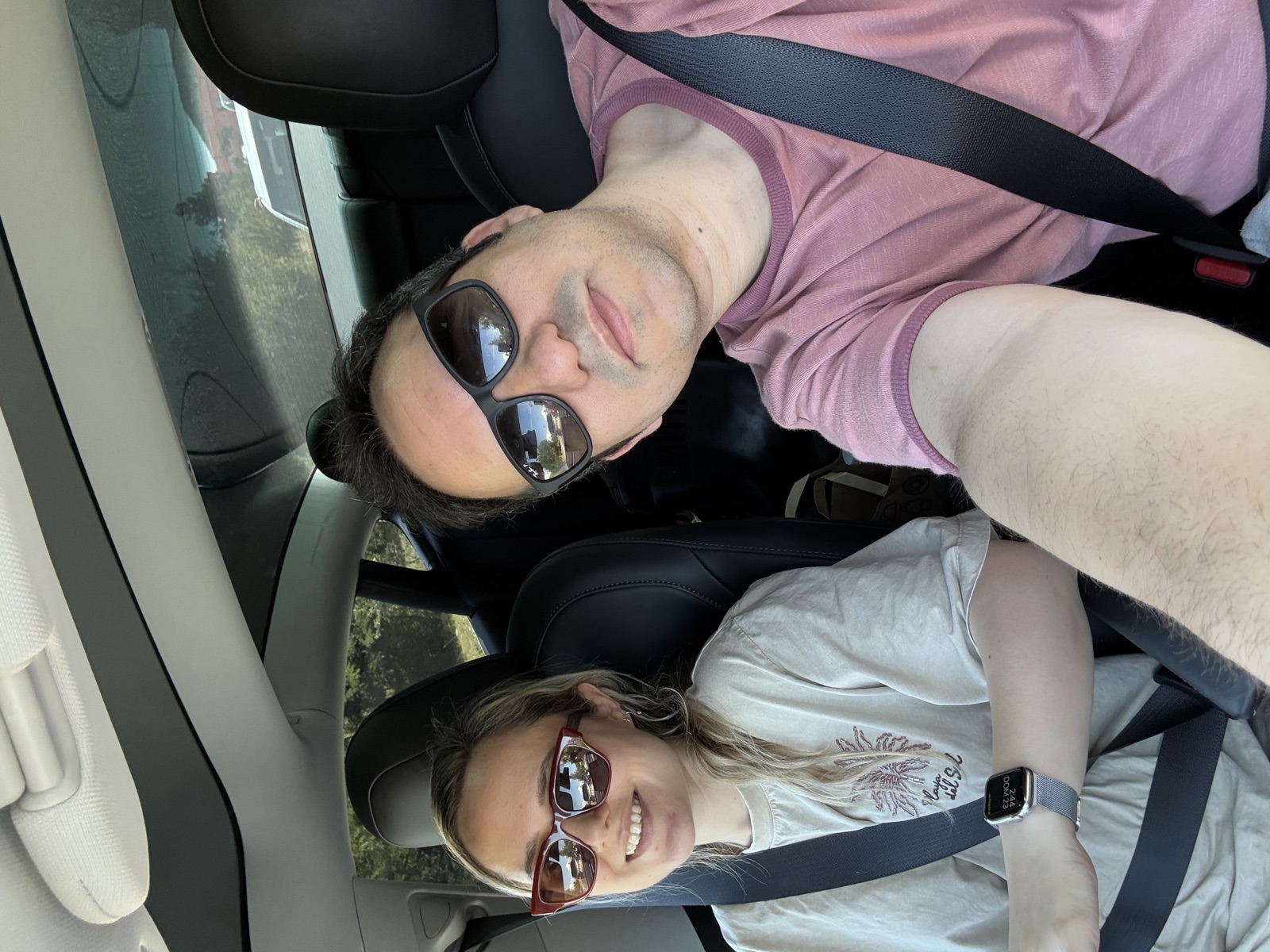 Carla and Gonzalo selfie inside the Tesla during the Europe road trip